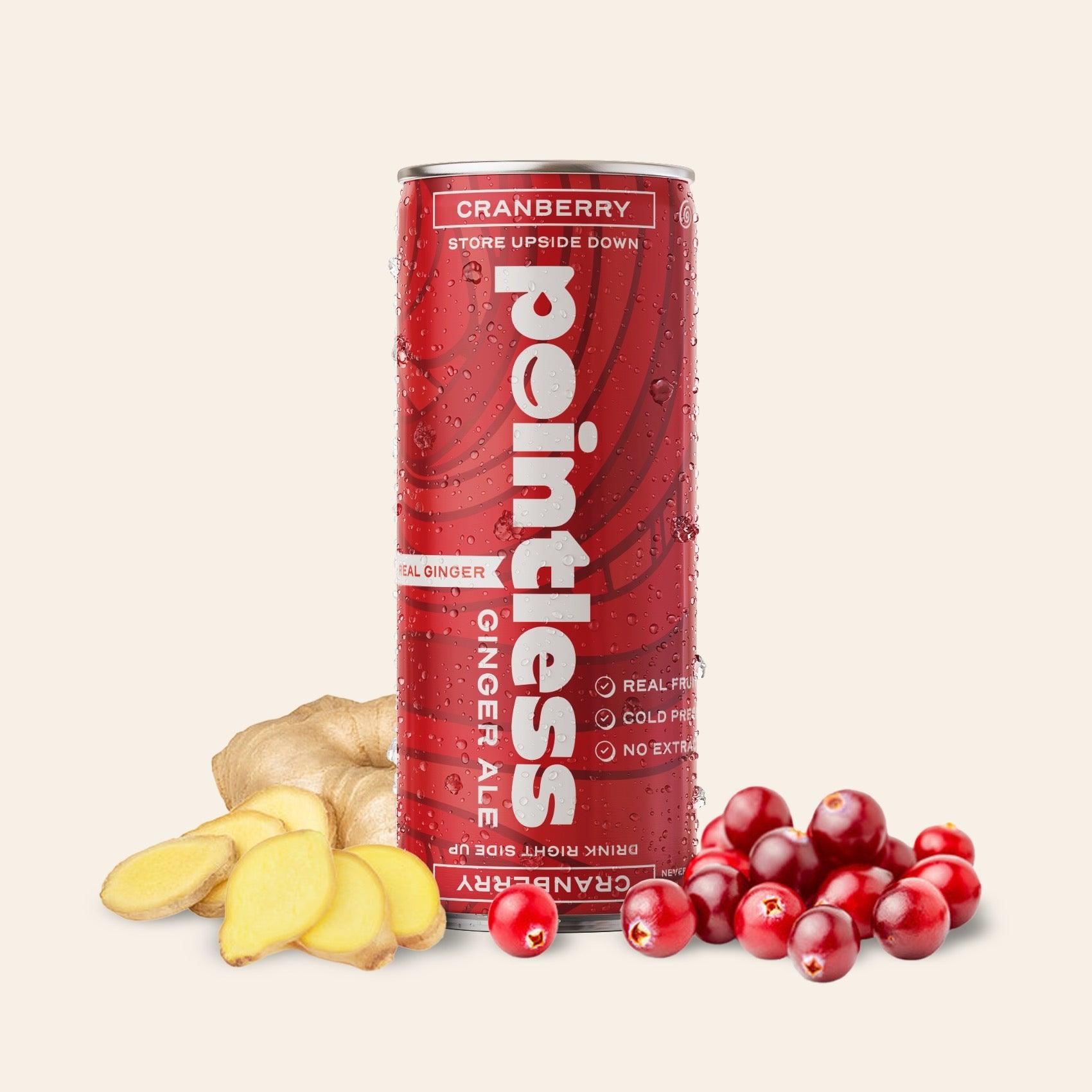 a can of cranberry ginger ale next to a pile of cranberries